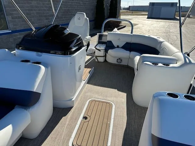 Slide: The Image of 2024 JC Spirit 221 TT Sport boat interior with white and blue seating. - 9