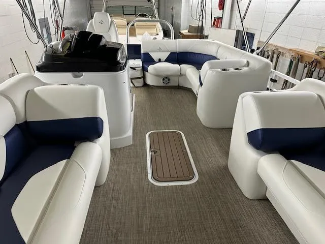 Slide: The Image of 2024 JC Spirit 221 TT Sport boat interior with white and blue seating. - 17