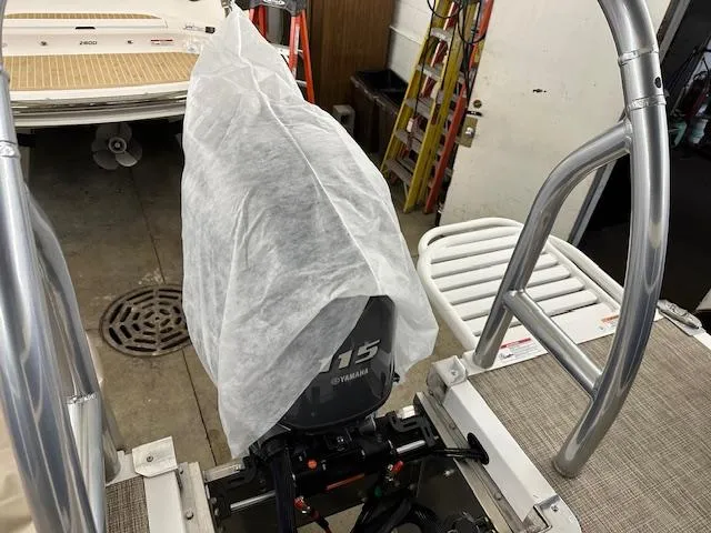 Slide: The Image of 2024 JC Spirit 221 TT Sport boat with Yamaha 115 engine in storage. - 19