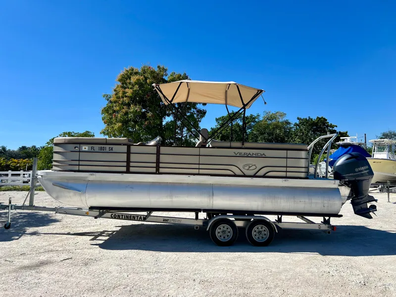 Slide: The Image of 2016 Crest Veranda V2275RC pontoon boat on trailer with canopy. - 2