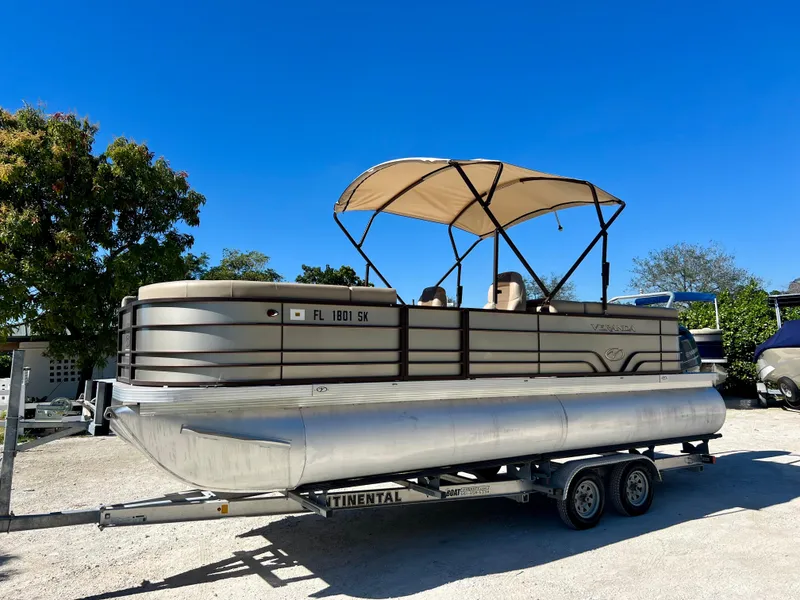 Slide: The Image of 2016 Crest Veranda V2275RC pontoon boat on a trailer with canopy. - 6