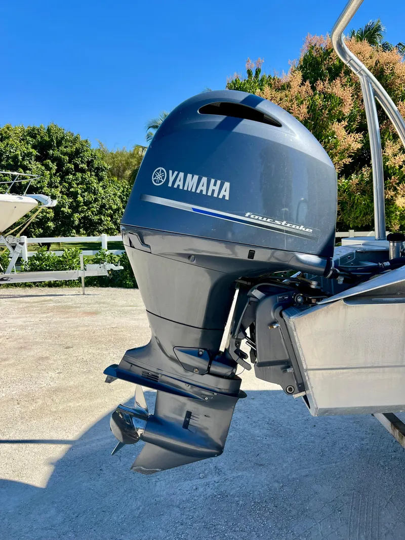 Slide: The Image of 2016 Crest Veranda V2275RC with Yamaha outboard motor in a sunny outdoor setting. - 9