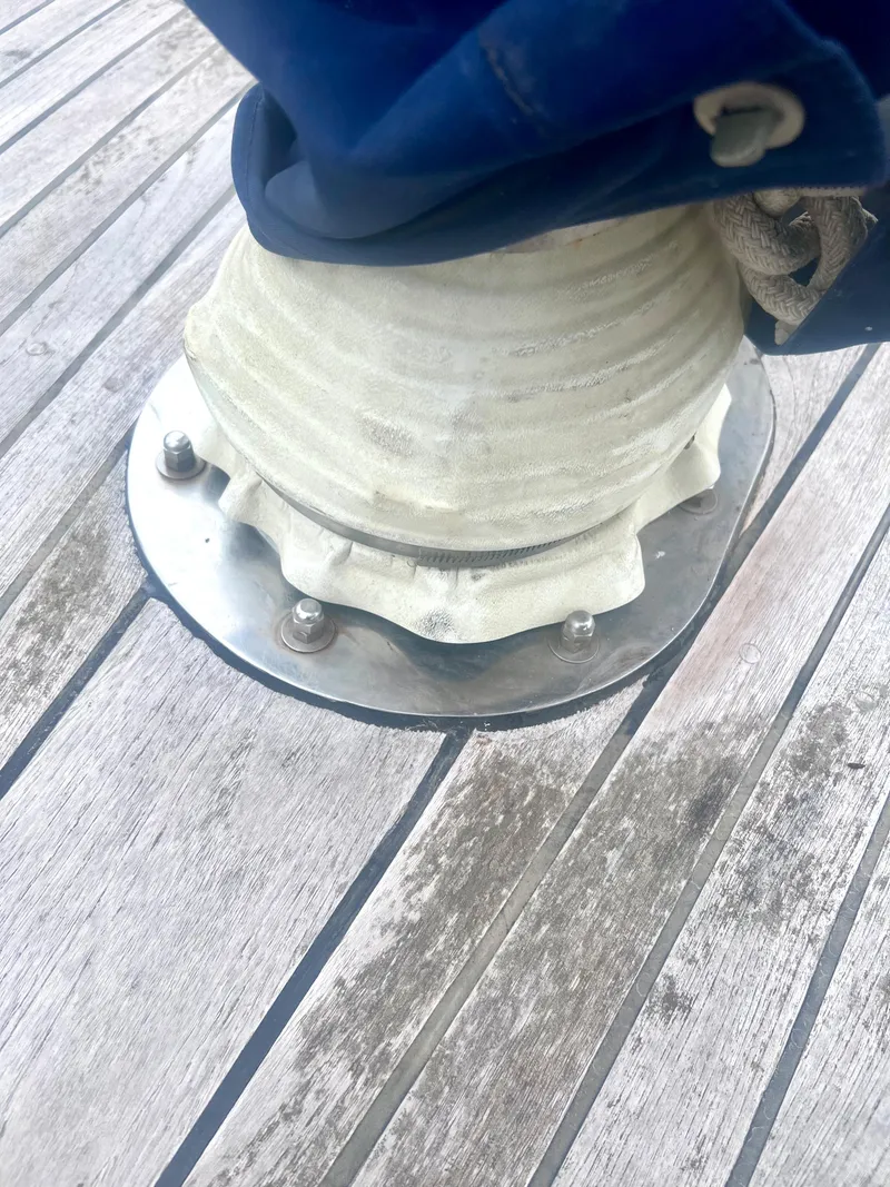 Slide: The Image of Deck fitting on 1980 Lafitte 44 sailboat with wooden planks. - 14