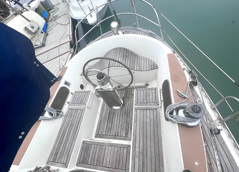 Slide: The Image of Cockpit of 1980 Lafitte 44 sailboat with wooden flooring and steering wheel. - 15