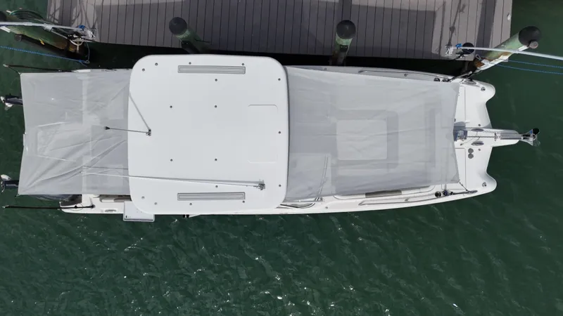 Slide: The Image of Aerial view of 2019 World Cat 255 DC boat docked with twin engines. - 11