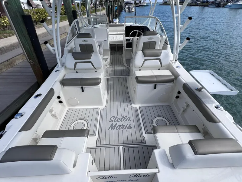 Slide: The Image of 2019 World Cat 255 DC boat interior with spacious seating and sleek design. - 21