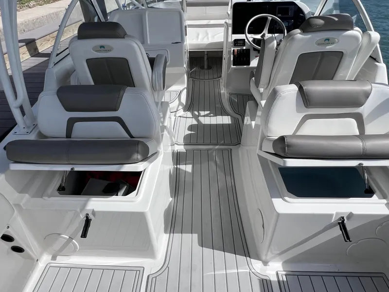 Slide: The Image of Close-up of a 2019 World Cat 255 DC boat's anchor winch on deck. - 27