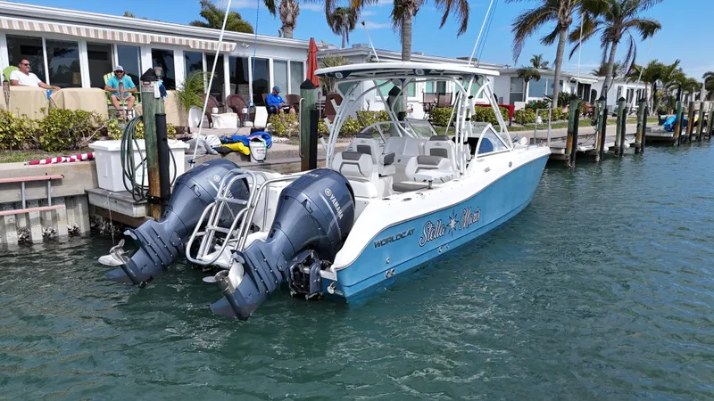 Slide: The Image of 2019 World Cat 255 DC boat with Yamaha engines on clear blue water. - 3