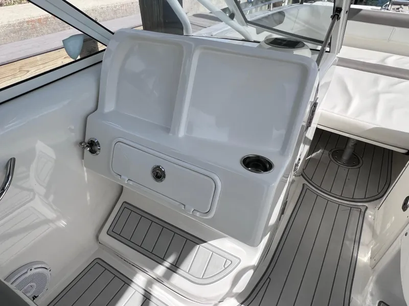 Slide: The Image of 2019 World Cat 255 DC boat interior with dual engines, spacious seating, and sleek design. - 48