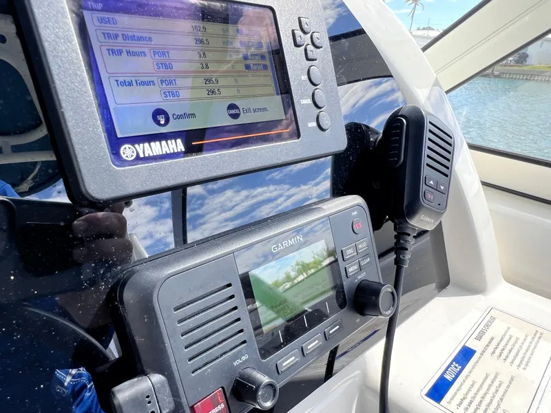 Slide: The Image of Open storage compartment on a 2019 World Cat 255 DC boat, showing interior details. - 55