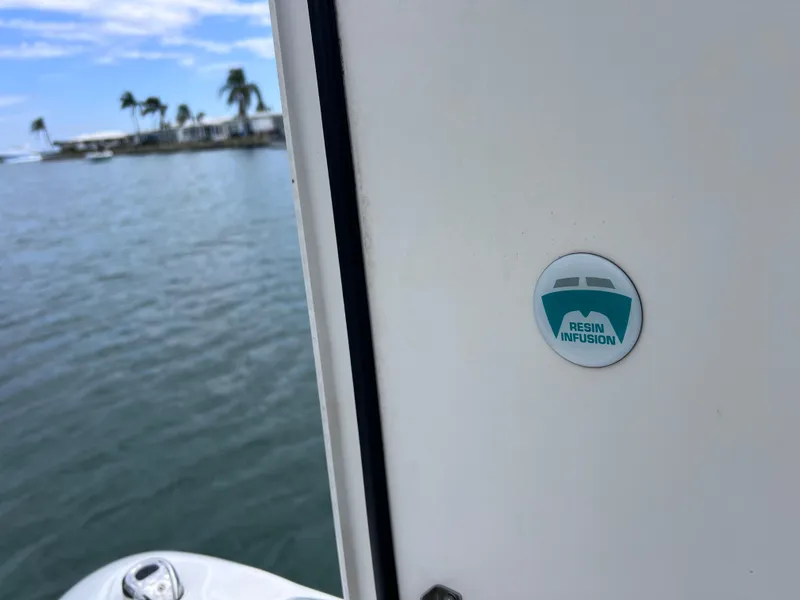 Slide: The Image of 2019 World Cat 255 DC boat seat with gray and white upholstery. - 60