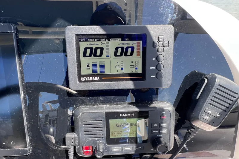 Slide: The Image of Yamaha and Garmin displays on 2019 World Cat 255 DC boat dashboard. - 66