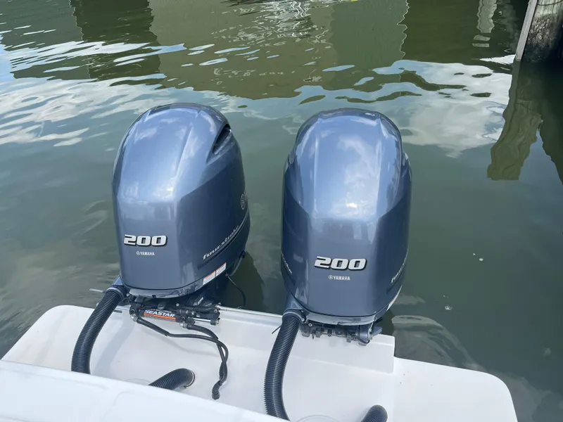 Slide: The Image of Twin Yamaha 200 outboard motors on a 2015 Regulator 25 boat. - 4