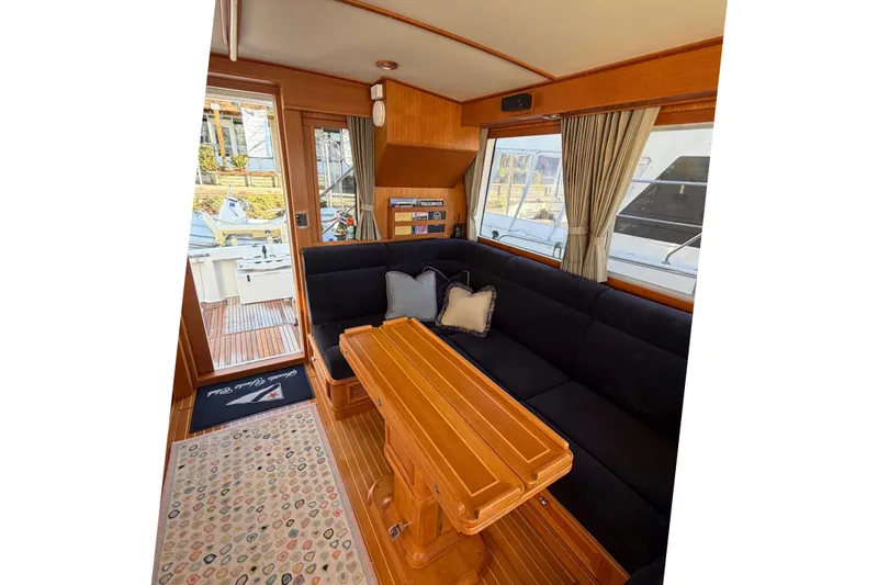 Slide: The Image of 2007 Grand Banks 47 Eastbay FB yacht with elegant deck and spiral staircase. - 10