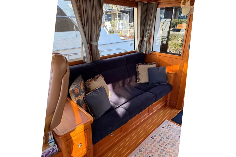 Slide: The Image of 2007 Grand Banks 47 Eastbay FB yacht deck with scenic bridge and waterfront view. - 12