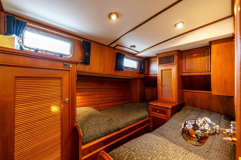 Slide: The Image of Luxurious 2007 Grand Banks 47 Eastbay FB cabin with twin beds and elegant wood finish. - 39