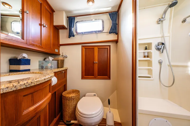 Slide: The Image of Luxurious 2007 Grand Banks 47 Eastbay FB yacht bathroom with wood cabinetry and modern shower. - 46