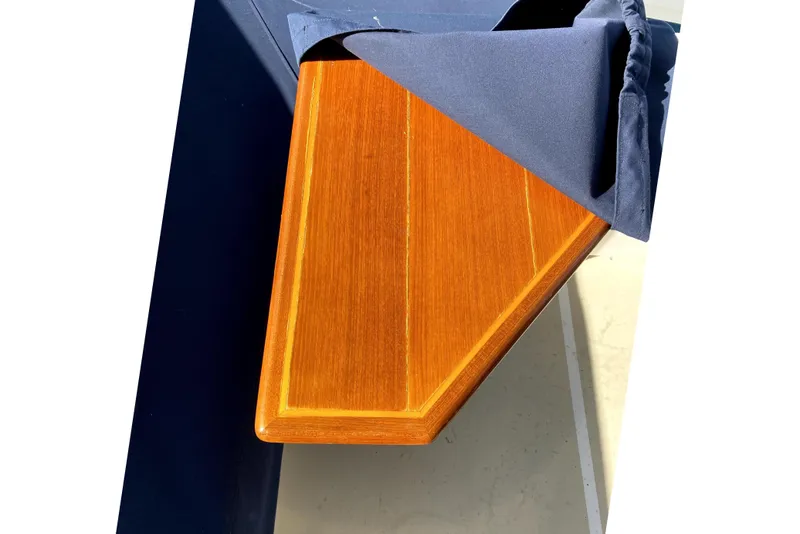 Slide: The Image of Wooden table on 2007 Grand Banks 47 Eastbay FB with blue cover. - 53