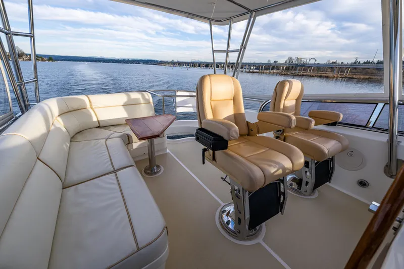 Slide: The Image of Luxurious 2007 Grand Banks 47 Eastbay FB yacht interior with plush seating and scenic water view. - 57