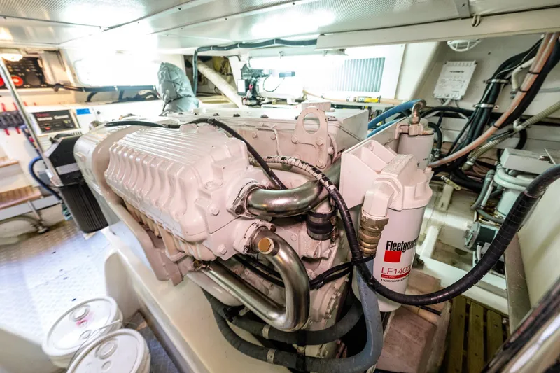 Slide: The Image of Engine room of 2007 Grand Banks 47 Eastbay FB, showcasing detailed machinery and components. - 62