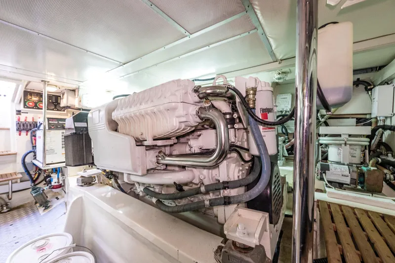 Slide: The Image of Engine room of 2007 Grand Banks 47 Eastbay FB yacht, showcasing mechanical components. - 63
