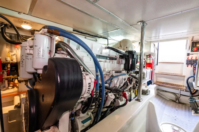 Slide: The Image of Engine room of 2007 Grand Banks 47 Eastbay FB yacht, showcasing detailed machinery and equipment. - 64