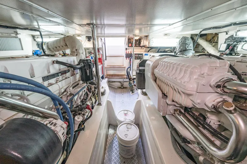 Slide: The Image of Engine room of 2007 Grand Banks 47 Eastbay FB yacht, showcasing dual engines and equipment. - 65