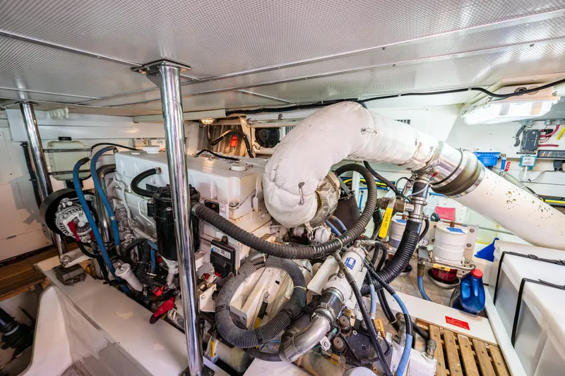 Slide: The Image of Engine room of 2007 Grand Banks 47 Eastbay FB yacht, showcasing mechanical components. - 66