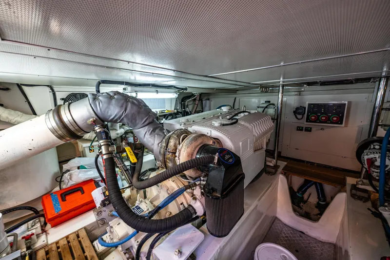 Slide: The Image of Engine room of 2007 Grand Banks 47 Eastbay FB yacht, showcasing machinery and controls. - 67