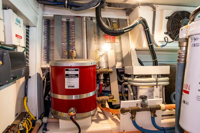 Slide: The Image of Engine room of 2007 Grand Banks 47 Eastbay FB with water heater and wiring. - 68
