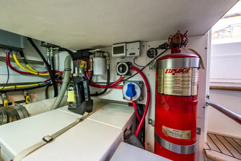 Slide: The Image of Engine room of 2007 Grand Banks 47 Eastbay FB with fire extinguisher and wiring. - 69