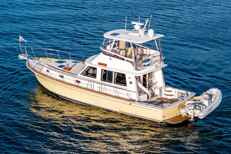 Slide: The Image of 2007 Grand Banks 47 Eastbay FB yacht cruising on open water. - 74