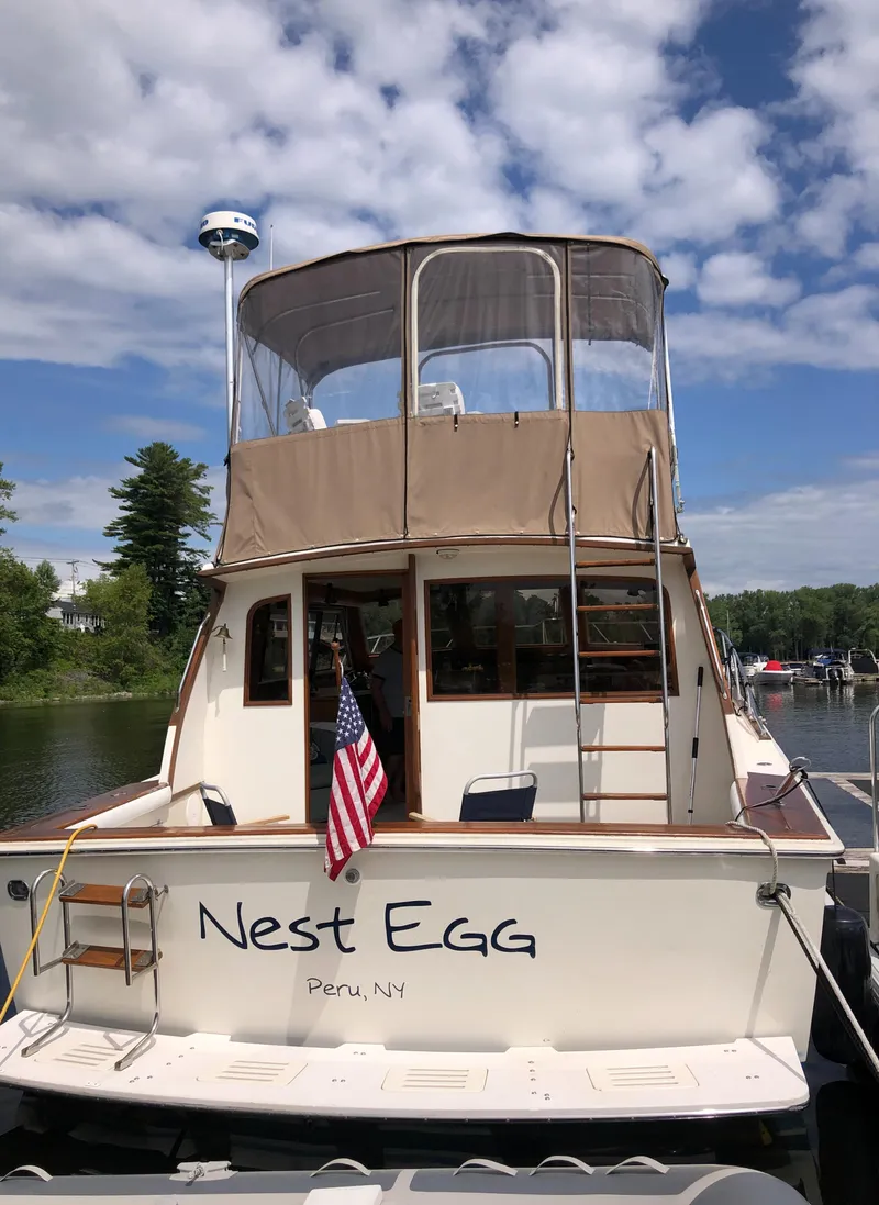 Slide: The Image of 1987 Egg Harbor Convertible 37 boat in harbor, "Nest Egg." - 2