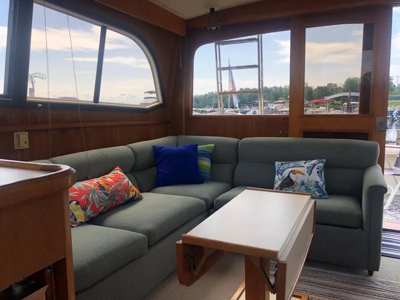 Slide: The Image of Interior of a 1987 Egg Harbor Convertible 37 yacht with cozy sofa. - 28