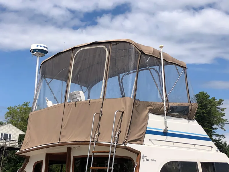 Slide: The Image of 1987 Egg Harbor Convertible 37 boat with canopy and radar. - 4