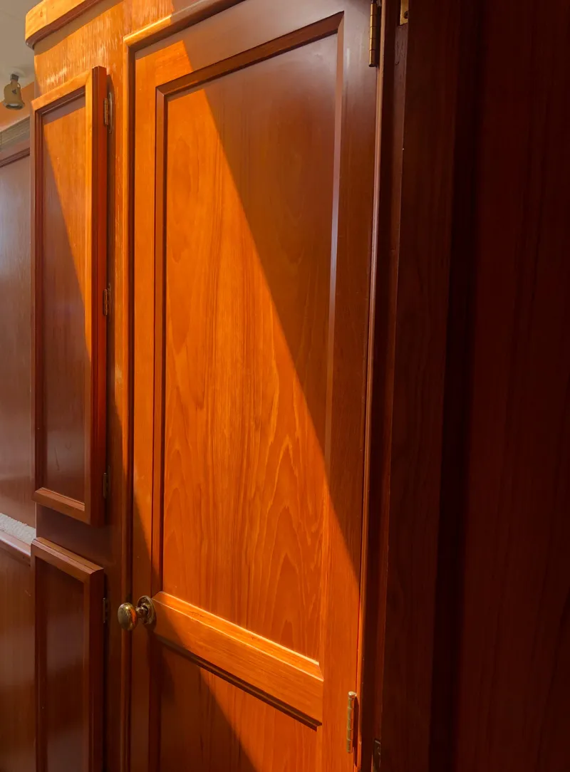 Slide: The Image of Wooden cabinets inside an Egg Harbor Convertible 37, 1987 model. - 44