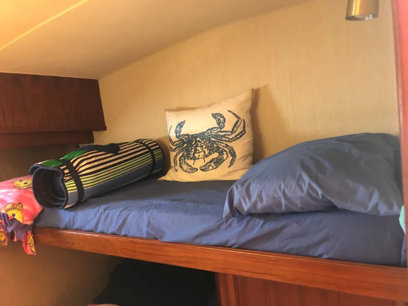 Slide: The Image of Cozy bunk on 1987 Egg Harbor Convertible 37 boat. - 47