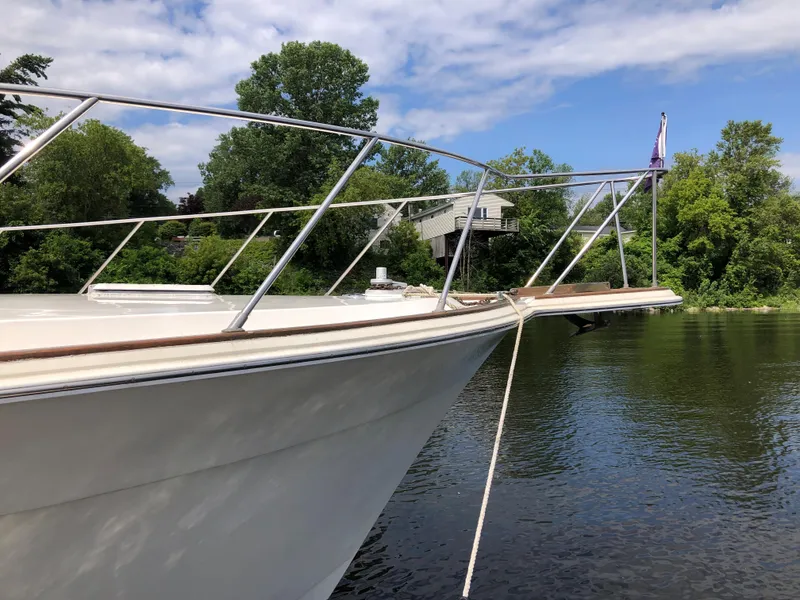 Slide: The Image of 1987 Egg Harbor Convertible 37 docked by the river. - 6