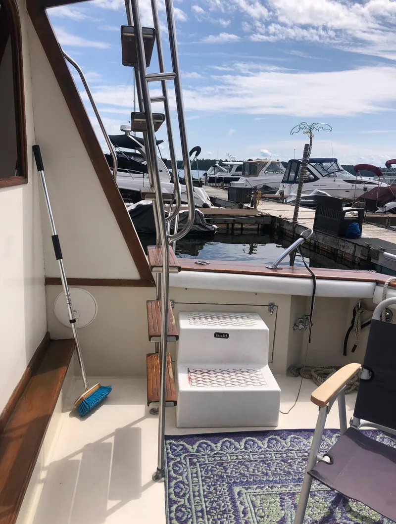 Slide: The Image of Deck of a 1987 Egg Harbor Convertible 37 with harbor view. - 8