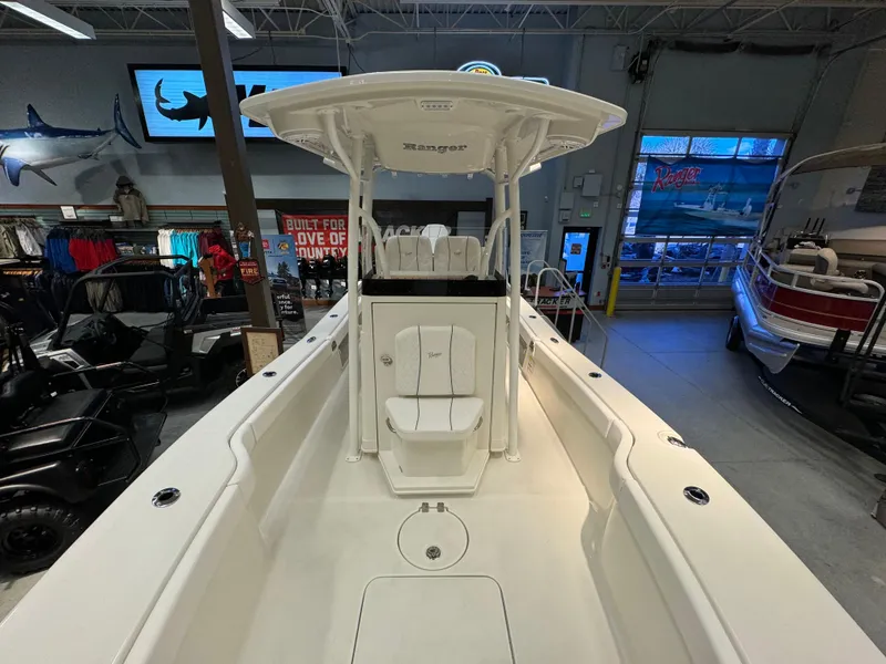 Slide: The Image of 2024 Ranger 2600 Bay boat interior at a showroom. - 9
