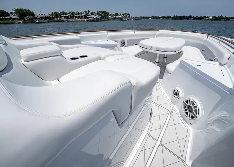 Slide: The Image of Luxurious seating area on the 2021 HCB Estrella boat with waterfront view. - 12