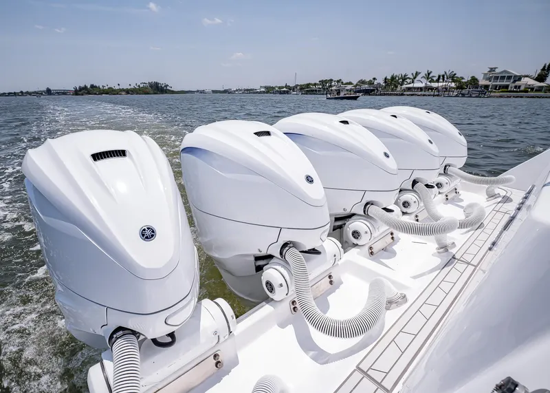 Slide: The Image of 2021 HCB Estrella boat with five powerful outboard engines on the water. - 14