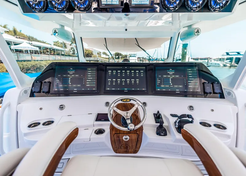 Slide: The Image of 2021 HCB Estrella boat helm with advanced navigation screens and controls. - 21