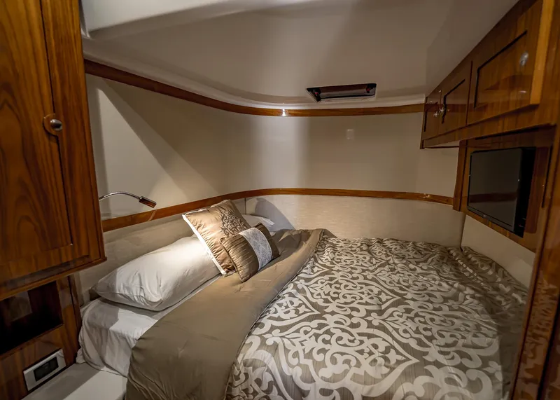 Slide: The Image of Luxurious bedroom interior of 2021 HCB Estrella yacht with elegant bedding and wooden cabinetry. - 25