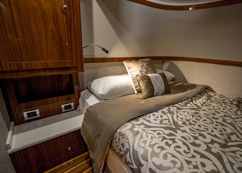 Slide: The Image of Luxurious bedroom interior of 2021 HCB Estrella yacht with elegant bedding and wooden cabinetry. - 27