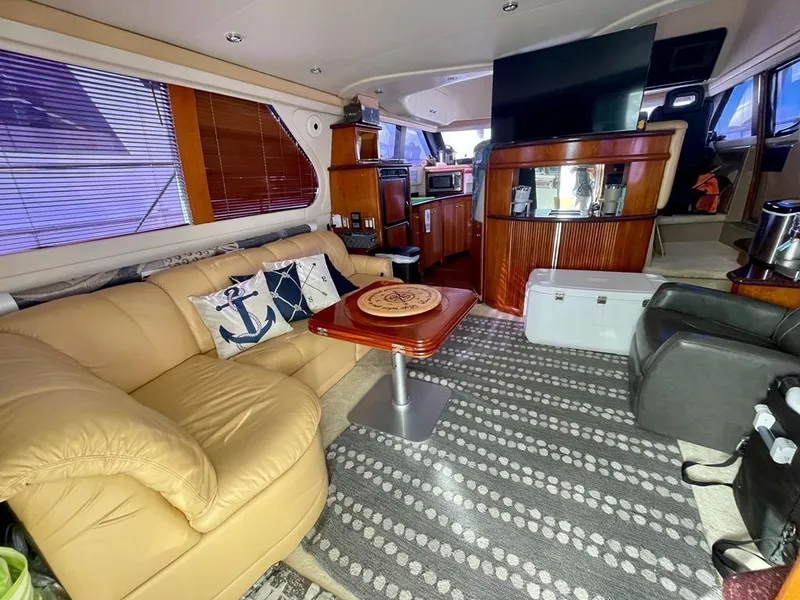 Slide: The Image of Luxurious interior of a 2000 Carver 45 Voyager yacht with leather seating and modern amenities. - 11