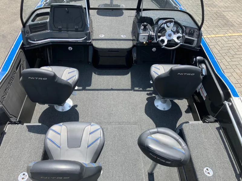 Slide: The Image of 2024 Nitro ZV20 Pro boat interior with steering wheel and seating arrangement. - 4