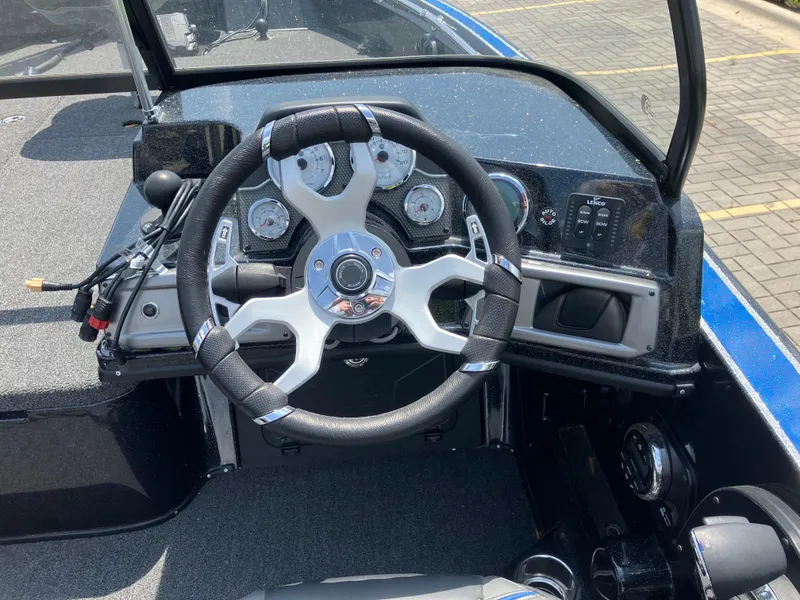 Slide: The Image of 2024 Nitro ZV20 Pro boat dashboard with steering wheel and control panel. - 5