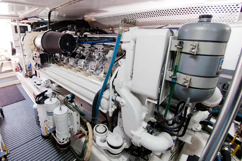 Slide: The Image of Engine room of 2000 Buddy Davis 78 yacht, showcasing detailed machinery and components. - 31