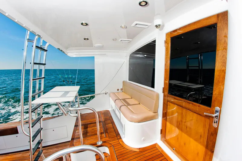 Slide: The Image of Luxurious 2000 Buddy Davis 78 yacht interior with ocean view and wooden deck. - 4